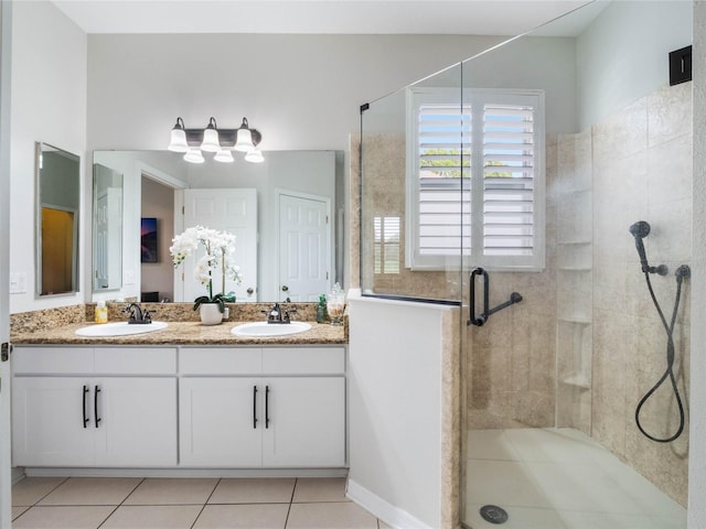 bathroom with tile patterned flooring, vanity, and an enclosed shower