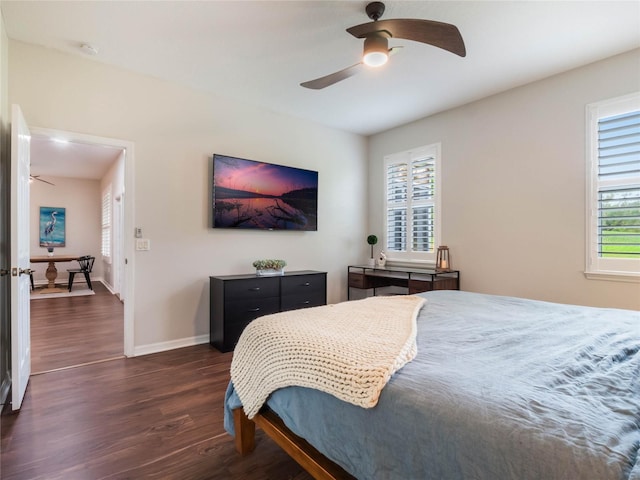 bedroom featuring ceiling fan and dark hardwood / wood-style floors