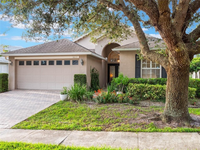 view of front of property with a garage