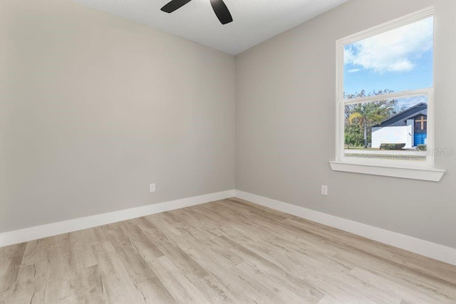 205 E 17th St, Apopka, FL 32703 - empty room featuring wood finished floors, a ceiling fan, and baseboards