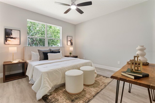 205 E 17th St, Apopka, FL 32703 - bedroom featuring light wood finished floors, baseboards, and ceiling fan