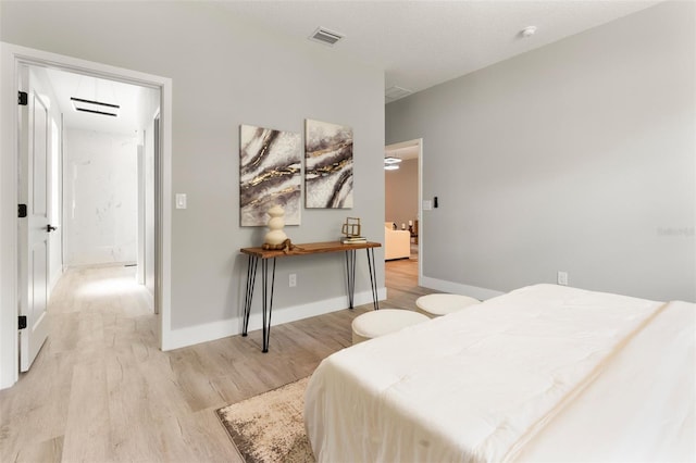 205 E 17th St, Apopka, FL 32703 - bedroom with light wood-style flooring and baseboards