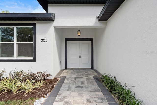 205 E 17th St, Apopka, FL 32703 - property entrance featuring stucco siding