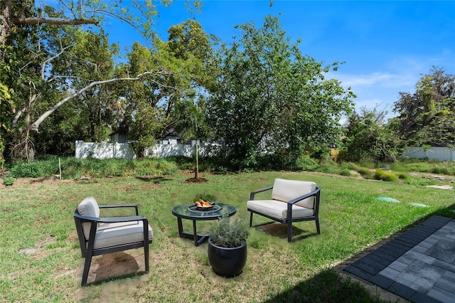205 E 17th St, Apopka, FL 32703 - view of grassy yard with an outdoor fire pit