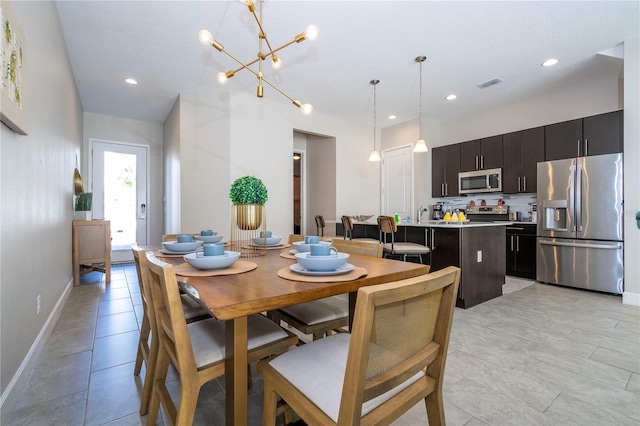 172 Villa Domani Cir, Davenport, FL 33896 - dining room featuring a chandelier, recessed lighting, and light tile patterned flooring