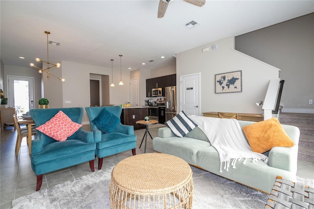 172 Villa Domani Cir, Davenport, FL 33896 - living area featuring a chandelier, ceiling fan, and light tile patterned floors