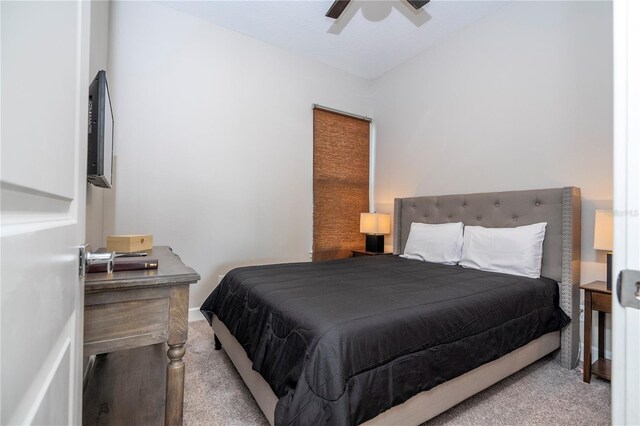 bedroom featuring ceiling fan and light colored carpet