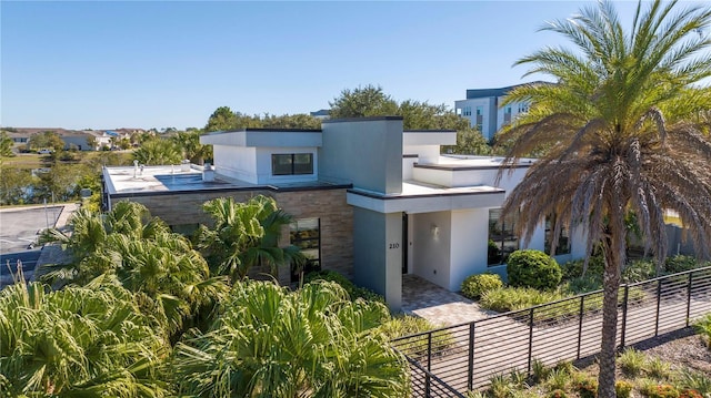 172 Villa Domani Cir, Davenport, FL 33896 - modern home with stucco siding and stone siding