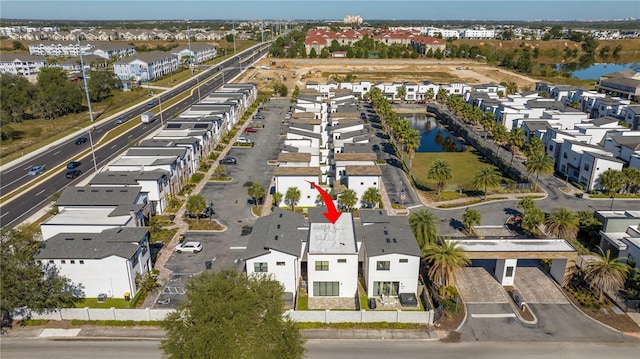 172 Villa Domani Cir, Davenport, FL 33896 - aerial view of property and surrounding area featuring a large body of water and nearby suburban area