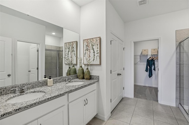 1708 Columbus Path, Saint Cloud, FL 34771 - bathroom with tile patterned flooring, vanity, and walk in shower
