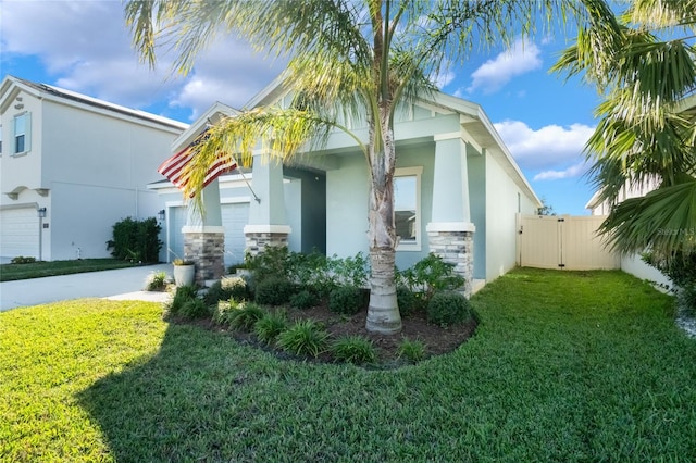 view of side of home featuring a lawn and a garage