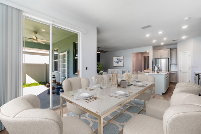 dining area featuring ceiling fan and light hardwood / wood-style floors