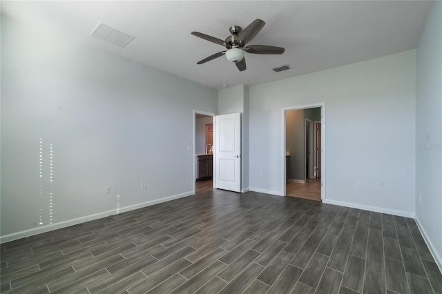 unfurnished bedroom with dark hardwood / wood-style floors and ceiling fan