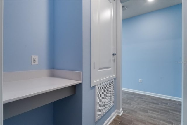 bathroom with hardwood / wood-style floors