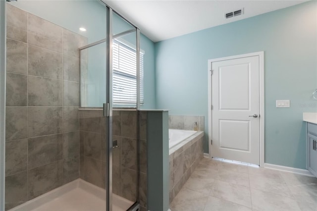 bathroom with tile patterned floors, vanity, and plus walk in shower