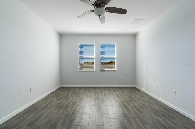 unfurnished room with ceiling fan and dark hardwood / wood-style floors