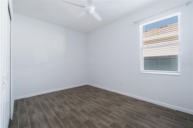 unfurnished room featuring ceiling fan and dark hardwood / wood-style flooring