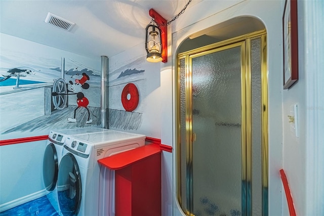 laundry room with independent washer and dryer