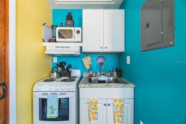 kitchen featuring a textured ceiling, white appliances, ventilation hood, and sink