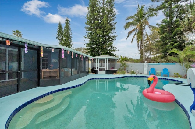 view of pool featuring a sunroom