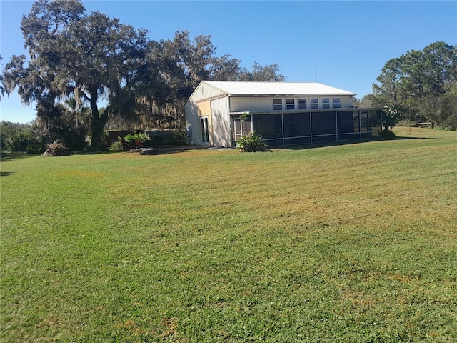 view of yard featuring a sunroom