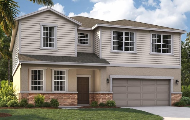 view of front of property featuring a front yard and a garage