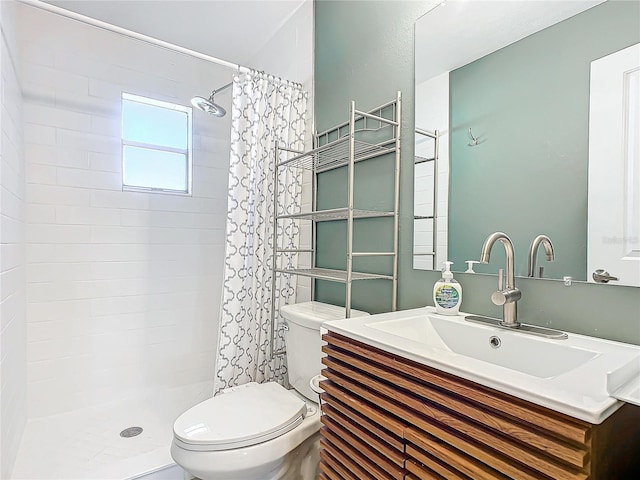 bathroom featuring a shower with curtain, vanity, and toilet