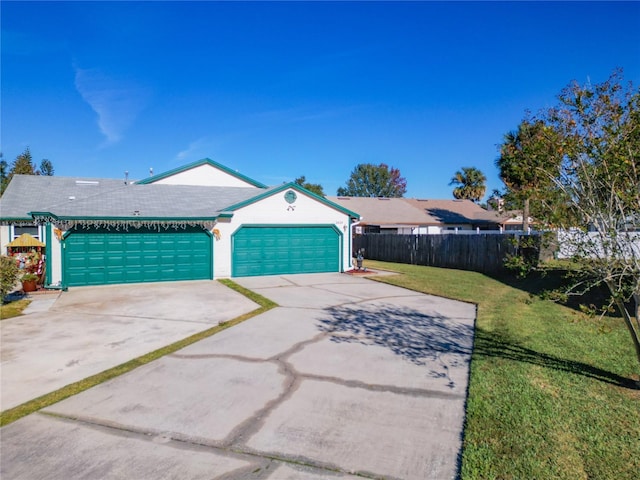 view of front of home featuring a front lawn and a garage