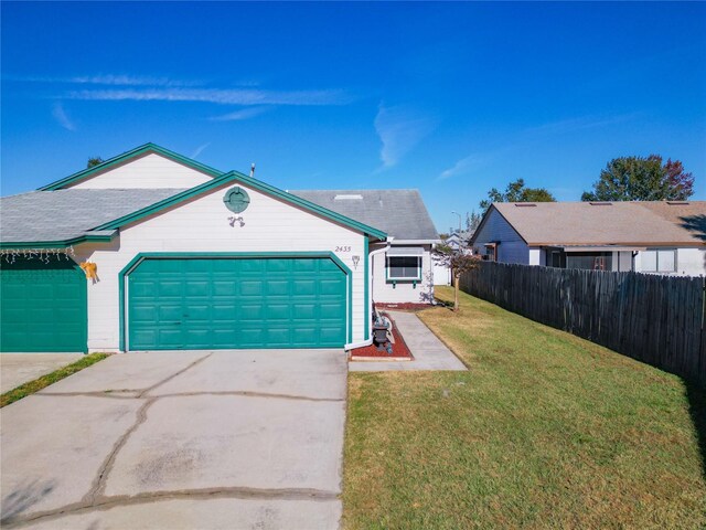 single story home with a front lawn and a garage