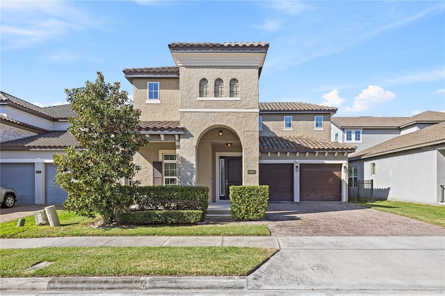 mediterranean / spanish house featuring a garage