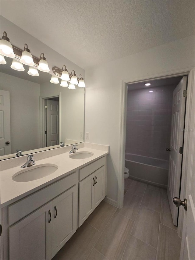 1162 Happy Forest Loop, Deland, FL 32720 - full bath with double vanity, toilet, and a textured ceiling