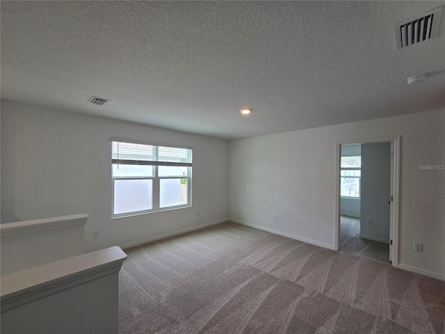 1162 Happy Forest Loop, Deland, FL 32720 - carpeted empty room featuring a textured ceiling, baseboards, and recessed lighting