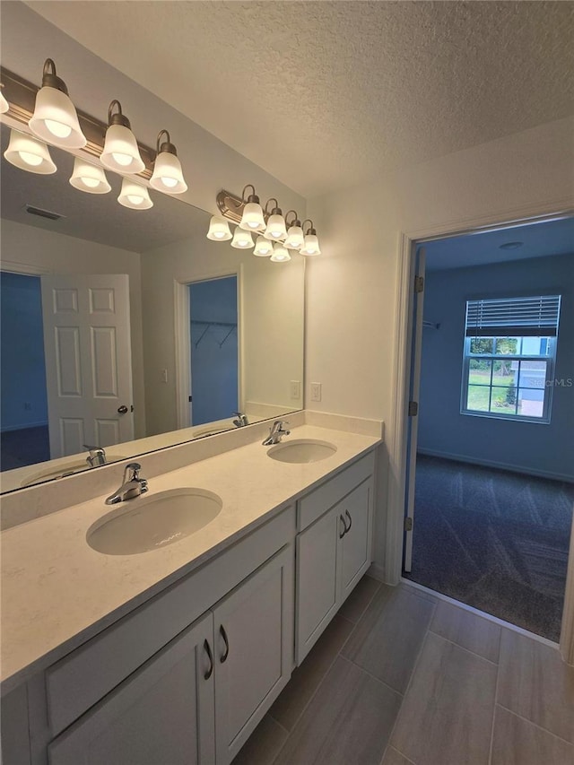 1162 Happy Forest Loop, Deland, FL 32720 - full bath with double vanity and a textured ceiling