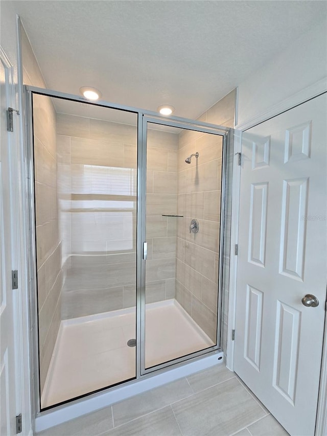 1162 Happy Forest Loop, Deland, FL 32720 - bathroom featuring a shower stall, tile patterned flooring, and recessed lighting