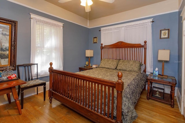 bedroom featuring light hardwood / wood-style flooring and ceiling fan