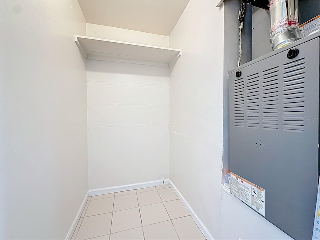 interior space featuring heating unit and light tile patterned floors