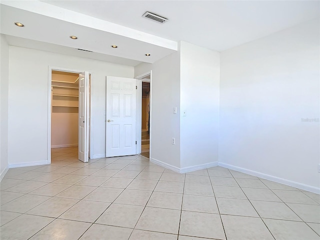 unfurnished room with light tile patterned floors