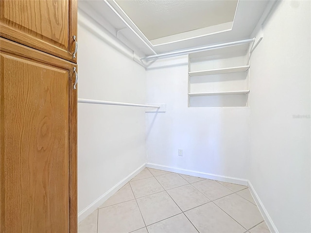 1037 Poinsetta St, Cocoa, FL 32927 - walk in closet with light tile patterned floors