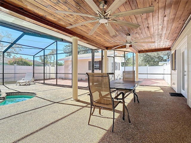 sunroom featuring a jacuzzi, ceiling fan, and wooden ceiling