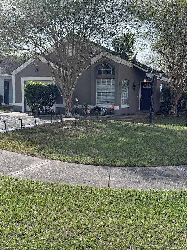 ranch-style house with a front yard