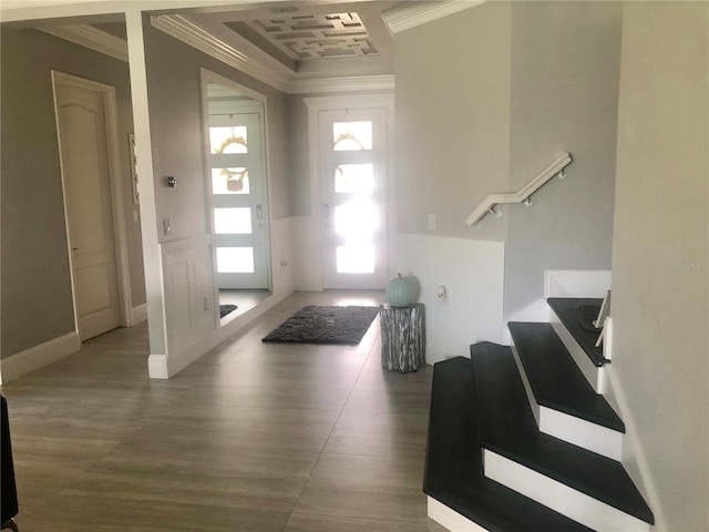 foyer featuring dark hardwood / wood-style flooring and ornamental molding