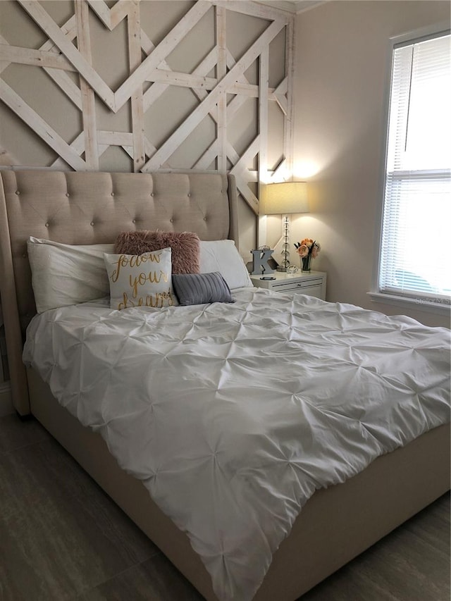 bedroom featuring dark hardwood / wood-style flooring