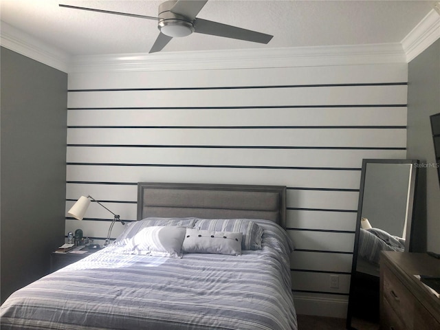 bedroom with ceiling fan and ornamental molding