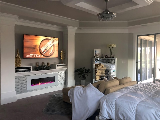 living room featuring a tray ceiling and ornamental molding