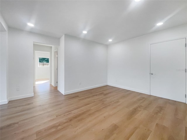 spare room featuring light hardwood / wood-style flooring