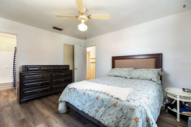 bedroom featuring wood finished floors, visible vents, and a ceiling fan