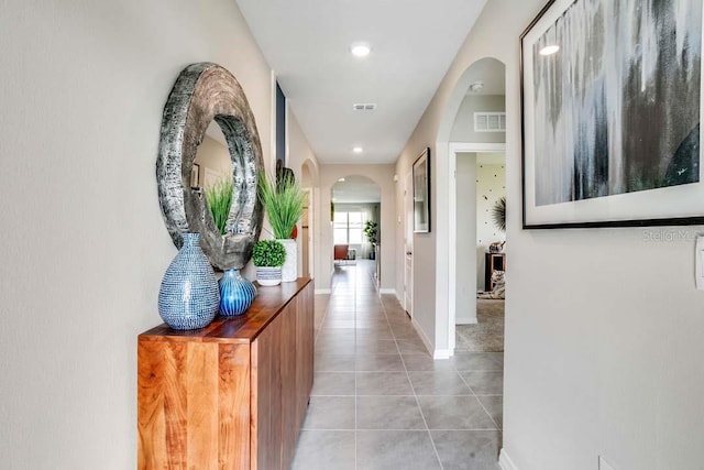 hallway with light tile patterned floors