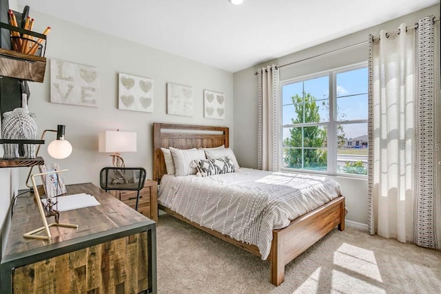 bedroom with light colored carpet