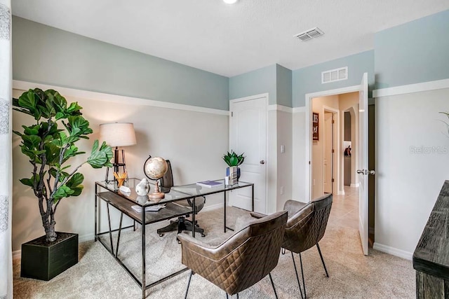 office area with light colored carpet