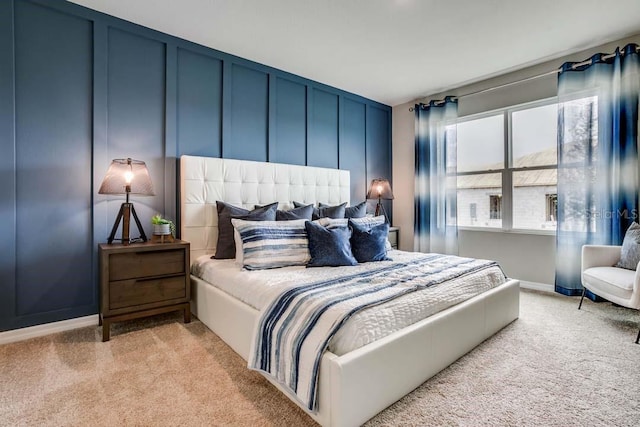 bedroom featuring light colored carpet